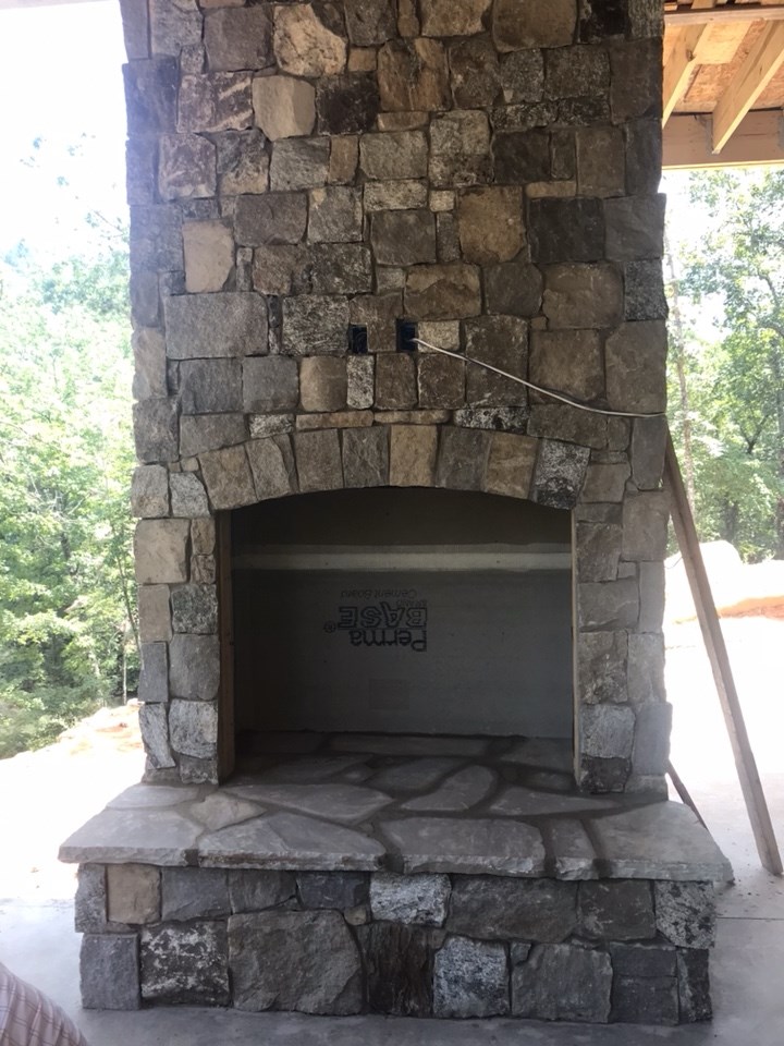 8-Screened-in porch fireplace getting stone